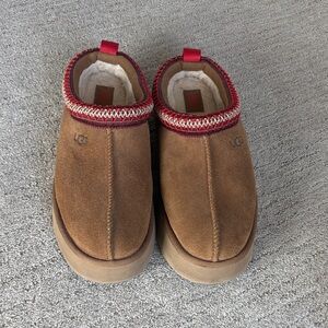UGG Tan Suede Slip-Ons with Red Trim
